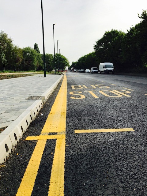Highway with bus stop markings and kerbing
